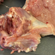 Close-up of raw chicken thigh to show location of bone